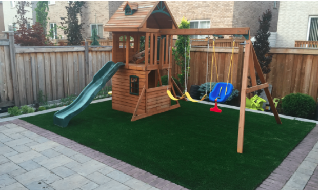 Backyard playground turf installation in Toronto by Lazy Lawn 